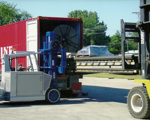 Loading a large lathe into a container