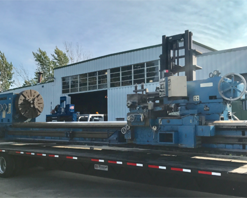 Large lathe being unloaded, 77,000lbs